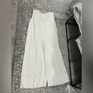 Free People cream jumpsuit. New with tags, size small.